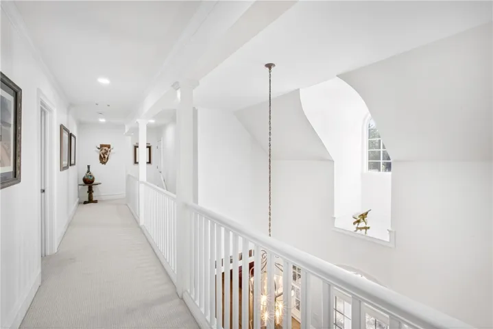 This bright hallway connects elegant spaces, offering a sophisticated transition between rooms.