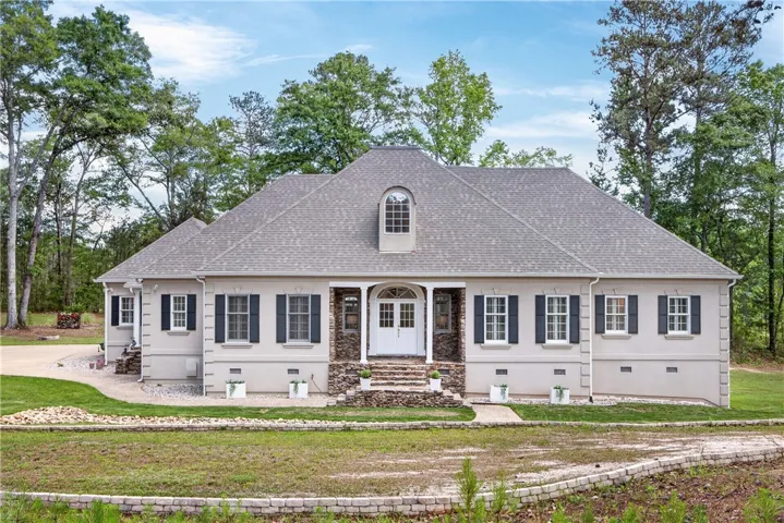 This charming home offers a perfect blend of comfort and natural beauty..