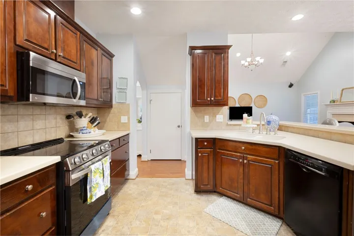 This spacious kitchen offers ample cabinetry and seamlessly connects to living areas.