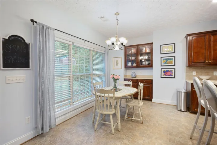 This eat-in kitchen features ample natural light and a practical layout.