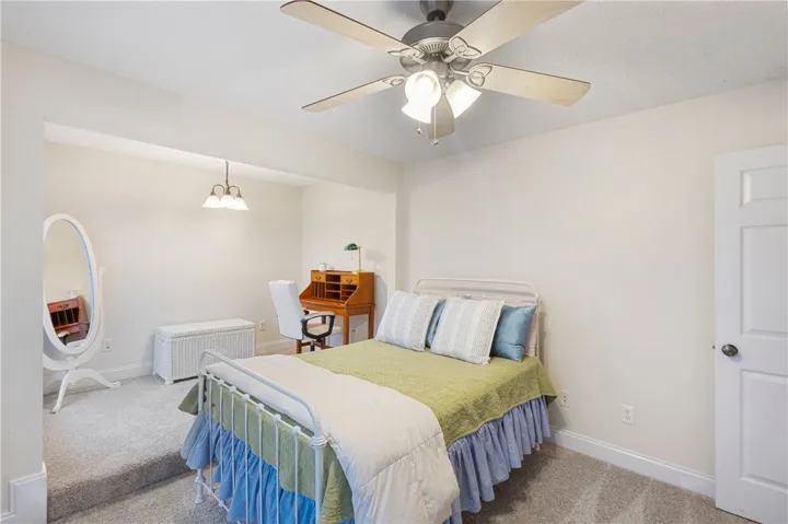 This cozy bedroom provides a comfortable retreat with ample space and essential amenities.