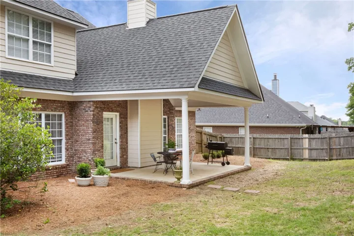 This residence features a covered patio perfect for outdoor enjoyment and relaxed gatherings.