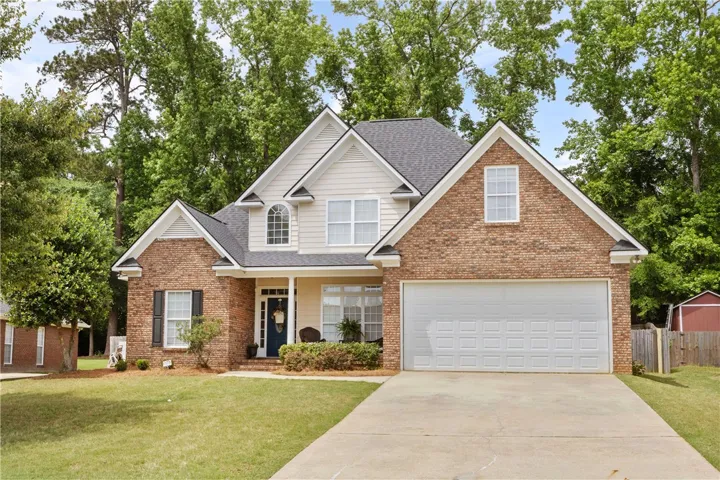 This classic brick and siding home offers curb appeal and a spacious driveway.