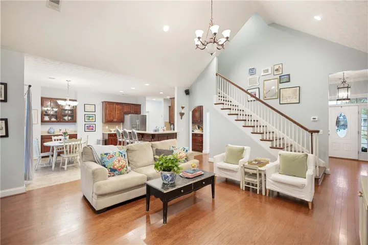This inviting home offers an open floorplan with rich hardwood floors and a grand staircase.