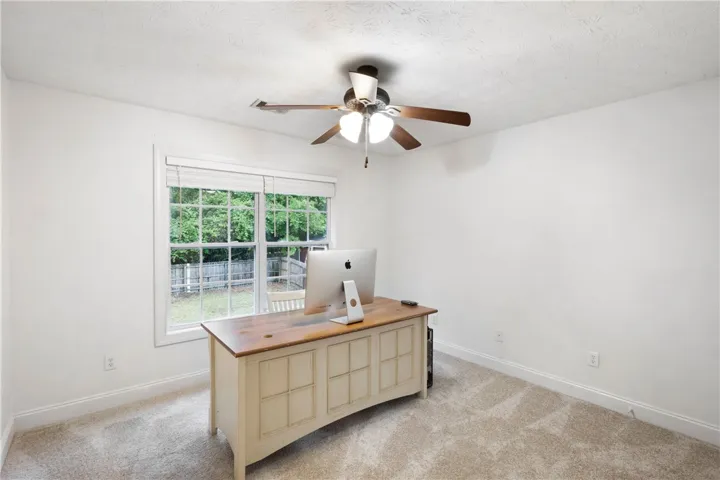 Bright and adaptable room, ideal for productivity or relaxation, features a scenic outdoor view.