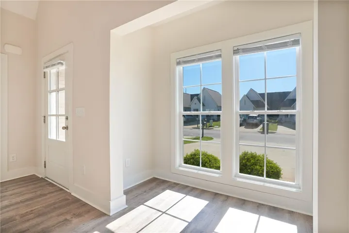 This bright entry offers a welcoming ambiance, perfect for greeting guests and enjoying natural light.