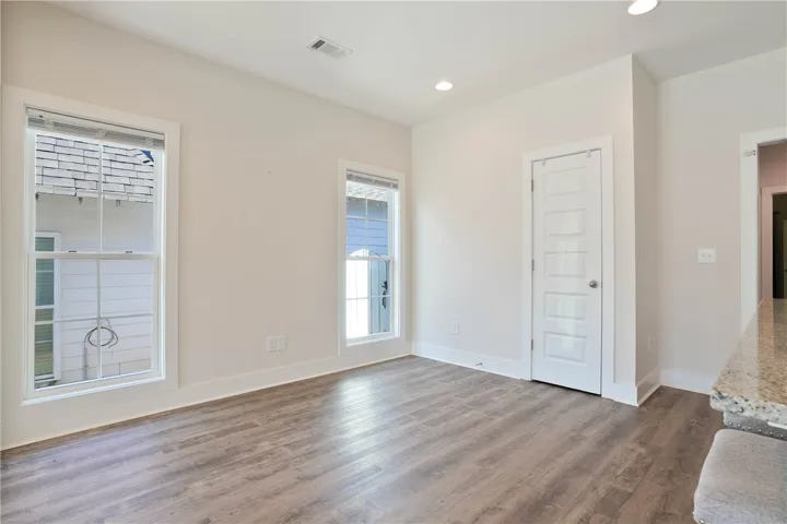 This bright space features natural light, creating an inviting atmosphere with durable flooring.