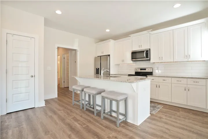 This bright kitchen features sleek appliances and ample counter space, perfect for everyday living.