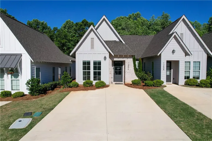 This charming residence features clean lines and a classic appeal, welcoming you home.