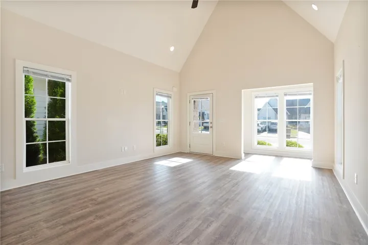 Bright and airy living space with vaulted ceilings and abundant natural light.