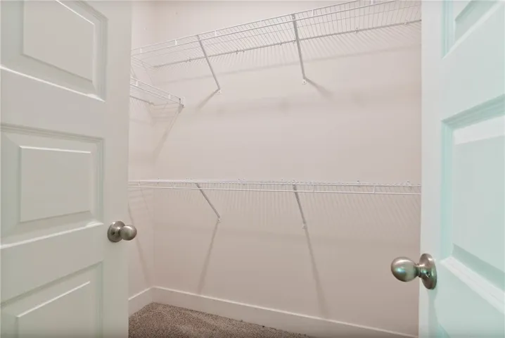 This spacious closet features wire shelving, providing versatile storage for your belongings.