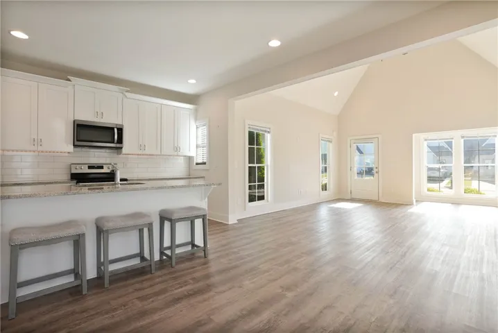 Bright and airy living spaces blend seamlessly with a modern kitchen, ideal for entertaining.