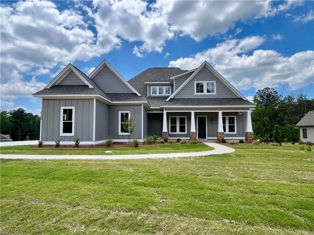 Attached Double Garage w/ Golf Cart Garage.