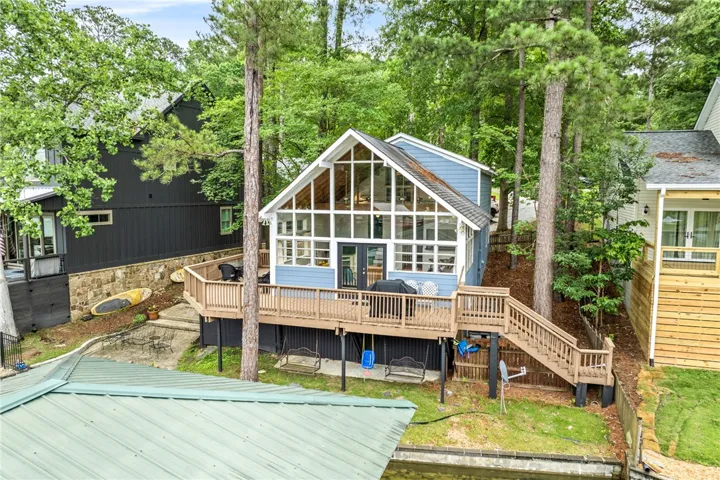 A delightful waterfront escape with extensive glasswork and a spacious deck, perfect for​​‌​​​​‌​​‌‌​‌‌​​​‌‌​‌​‌​‌​​​‌​​ leisure.