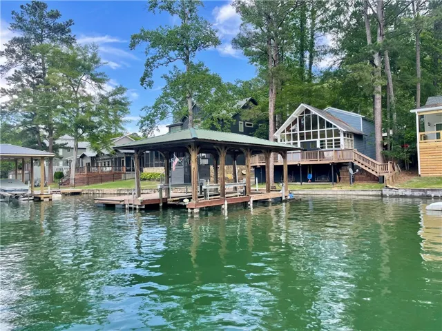 This serene lakefront home features a private dock and direct water access.