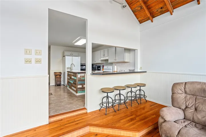 A dynamic split-level design connects living areas with a convenient kitchen pass-through.