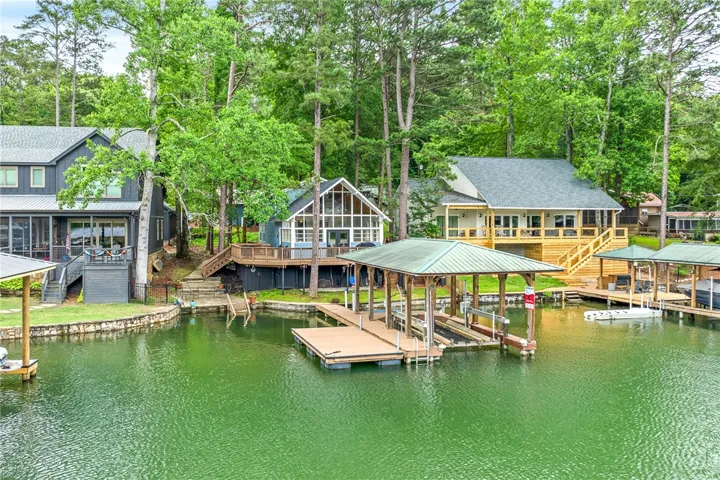 Boasting multiple docks and covered boat slips, this waterfront home provides exceptional lake access and serene views.