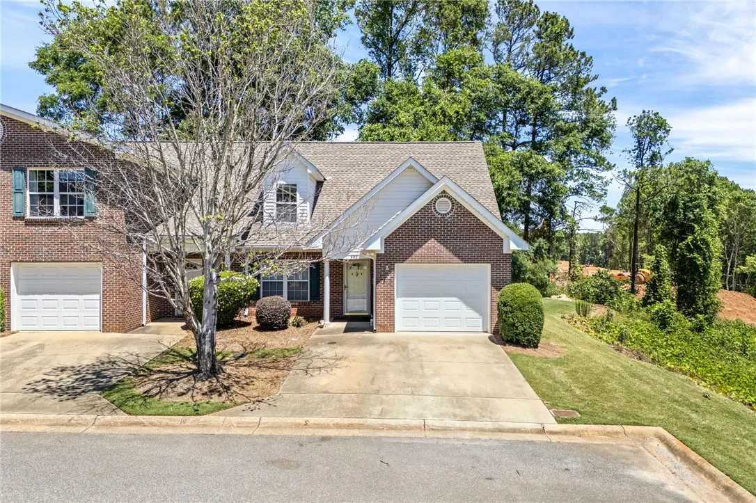 This charming home features classic brick and a well-maintained exterior, ready for its next owners.