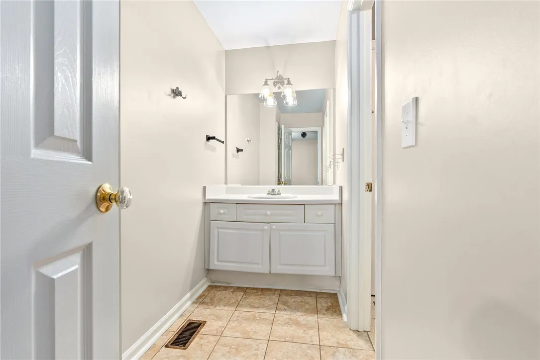 Functional vanity and mirror create a clean and welcoming powder room.