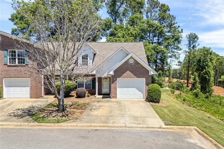 This charming home features classic brick and a well-maintained exterior, ready for its next owners.