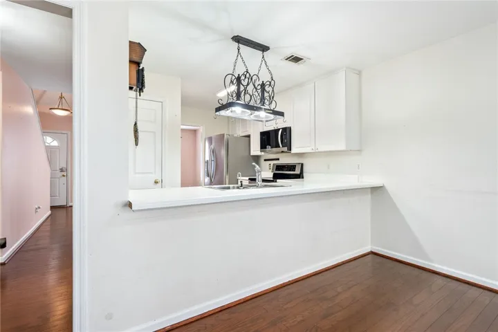 Bright, open kitchen with ample counter space and modern appliances for daily living.