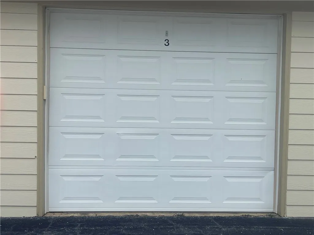 This clean garage provides secure parking and storage.