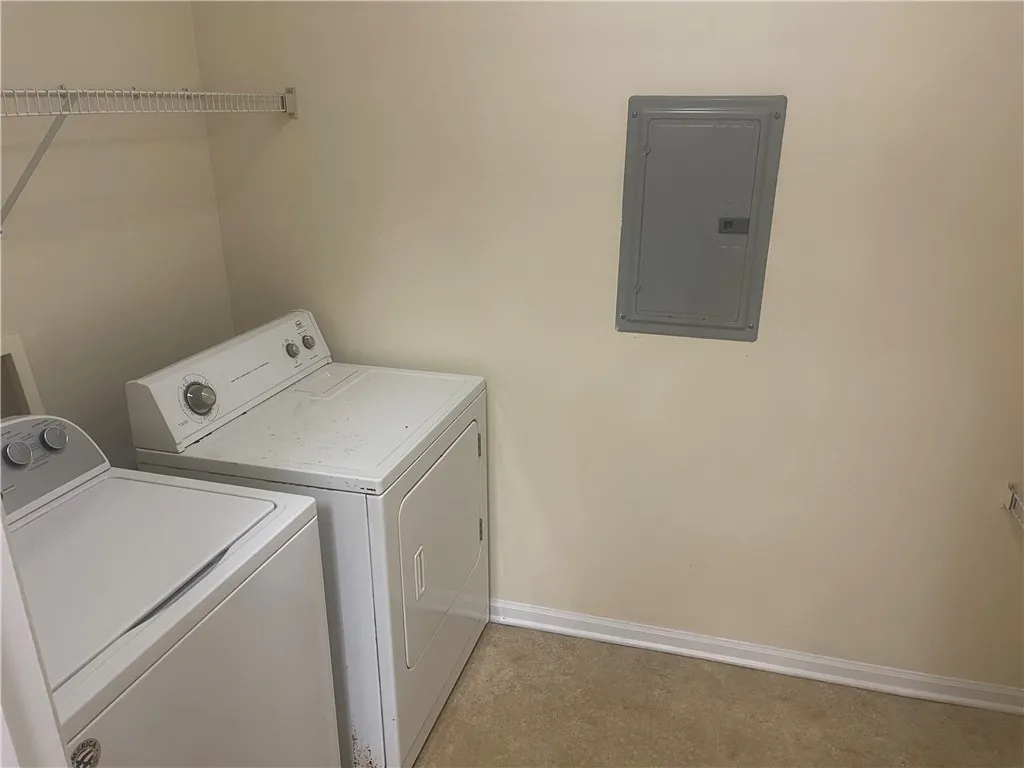 This dedicated space includes a washer and dryer for effortless daily routines.