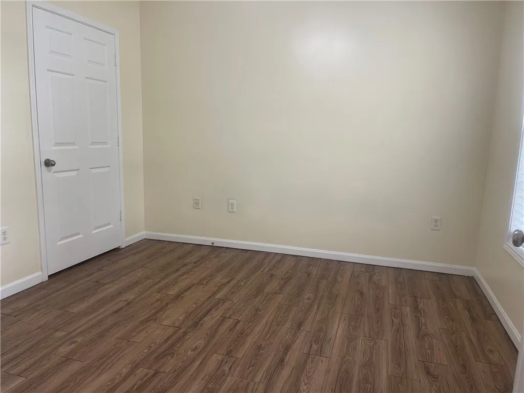 This versatile room features durable flooring and ample natural light, ideal for a flexible living space.