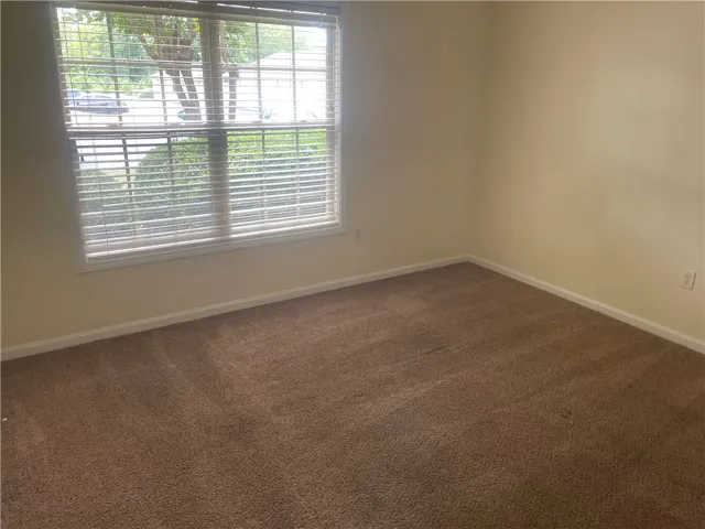 This cozy room offers natural light and a clean, inviting atmosphere.