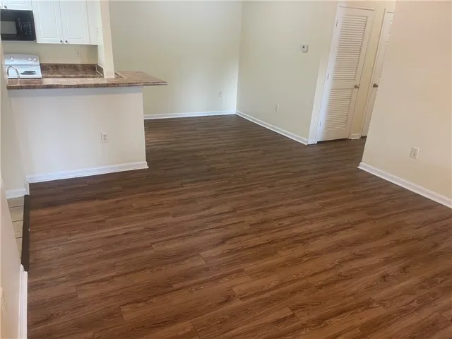 This living space offers an open concept design, creating an inviting and versatile atmosphere for everyday living.