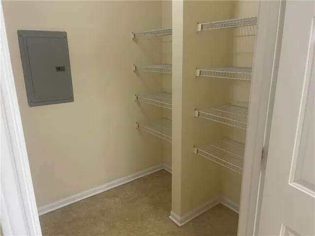 Functional pantry with ample wire shelving for organized storage.