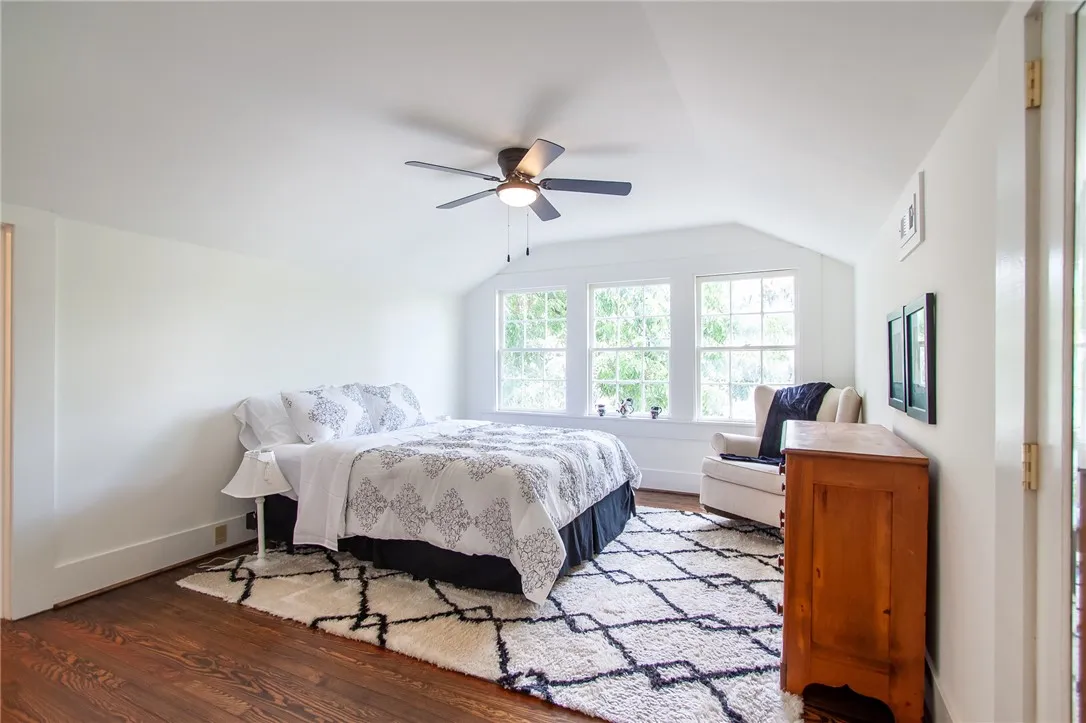 Bright and airy room with beautiful hardwood flooring.