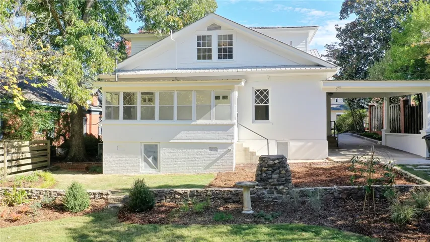 This charming home offers a spacious private yard and convenient attached carport.