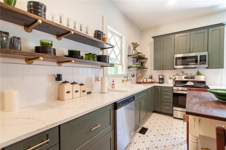 This modern kitchen offers ample counter space and storage, perfect for culinary endeavors.