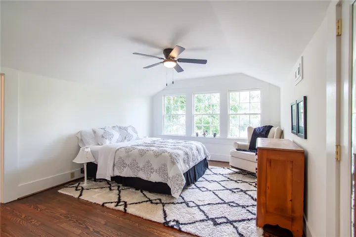 Bright and airy room with beautiful hardwood flooring.