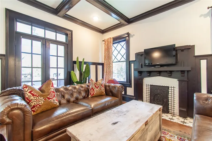 This living room features a fireplace and natural light, perfect for entertaining.