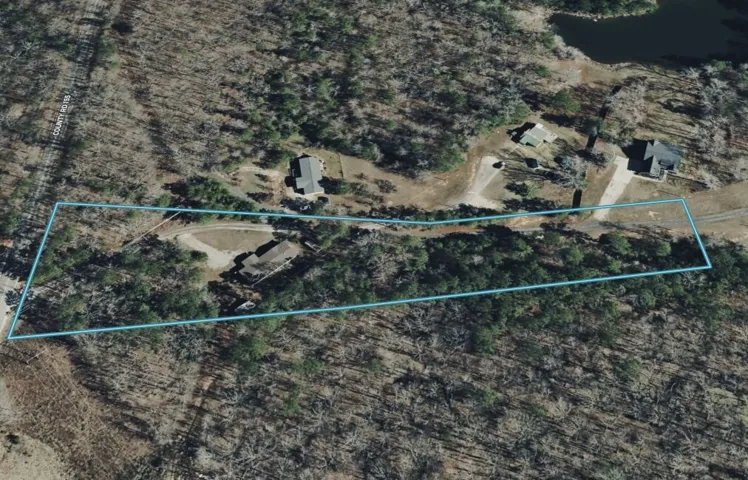 Discover this expansive, wooded lot offering natural tranquility and development potential.