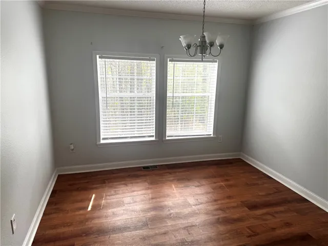 This airy dining area offers ample natural light, creating an inviting space for gatherings.