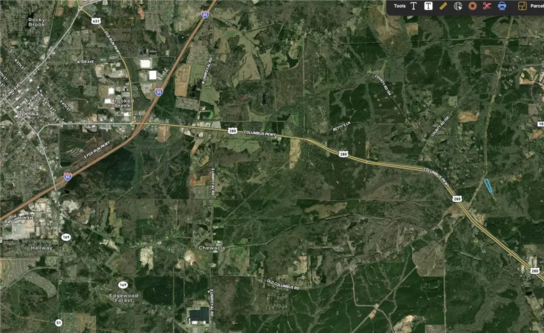 This aerial view showcases a vibrant community with convenient access to major roadways and surrounding natural landscapes.