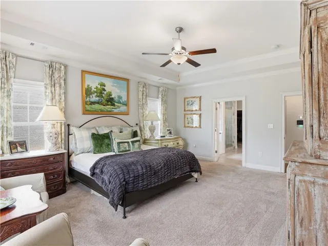 Relax in a generously proportioned sleeping area, crowned with tray ceilings and plush carpeting.