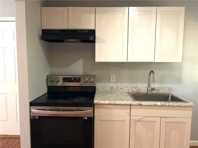 A well-appointed kitchen showcasing modern appliances and ample countertop space.