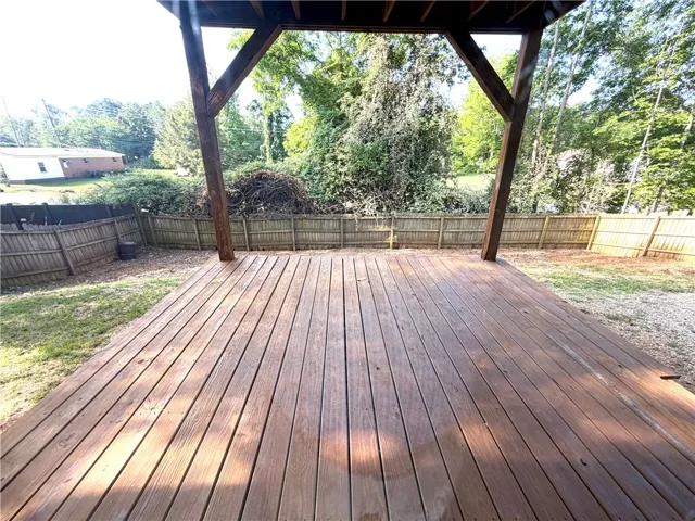 This spacious covered deck provides an excellent setting for outdoor enjoyment with its private fenced yard.