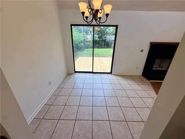 Sliding glass doors open to a generous deck, extending living space to the outdoors.