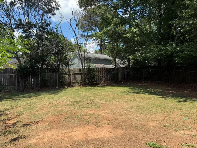 A spacious backyard awaits, offering ample room for outdoor recreation and landscaping dreams.