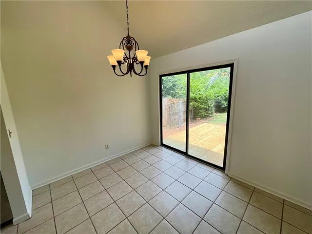 A sliding glass door opens to the outdoor deck, perfect for entertaining.