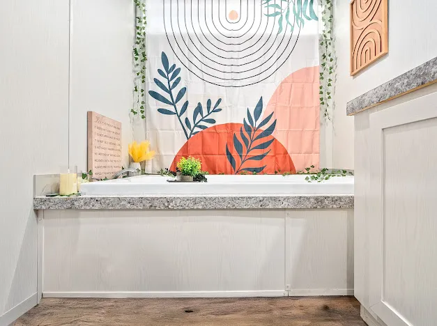 Indulge in relaxation within this primary bathroom featuring a spacious built-in tub with modern accents.