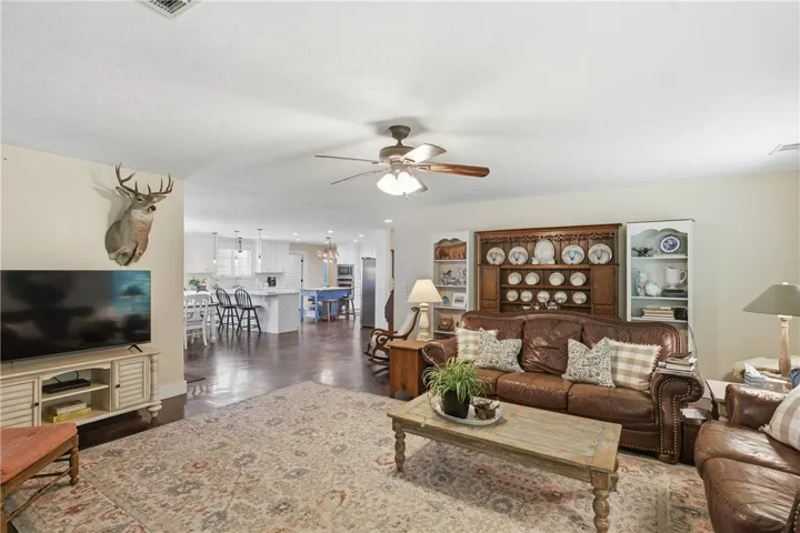 An inviting great room with an open-concept kitchen offers comfortable living and entertaining possibilities.