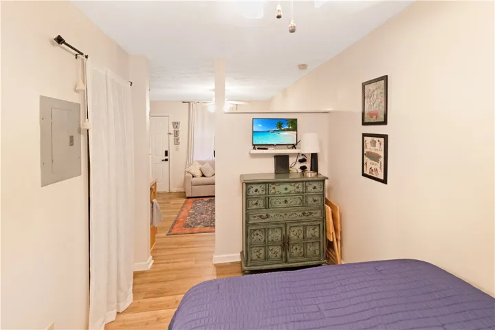 Wood flooring and neutral tones create an inviting and comfortable living area.