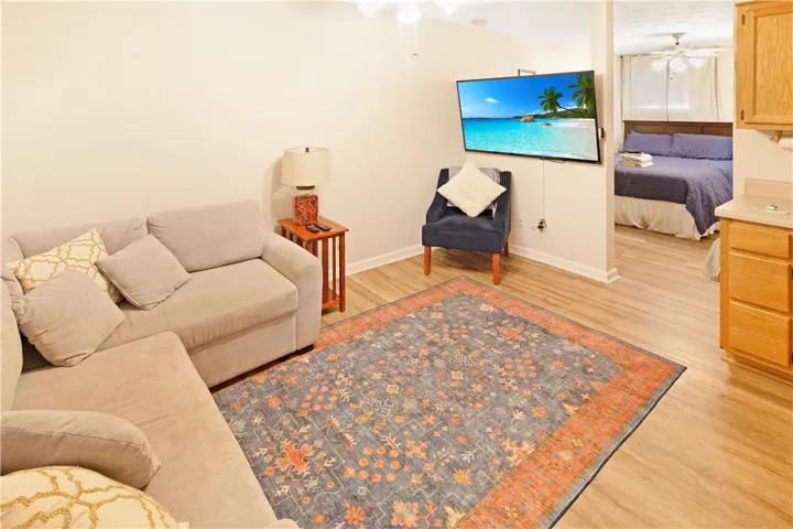 Comfortable living area flows seamlessly into the restful bedroom space.