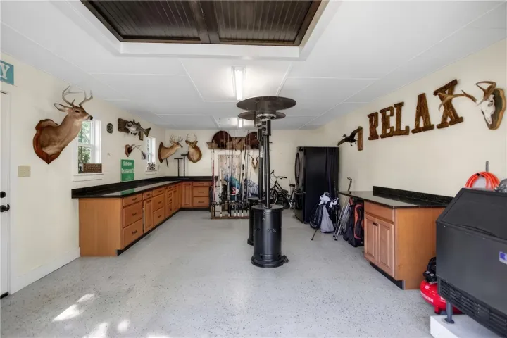 Ample counter space and cabinet storage define this adaptable utility room.